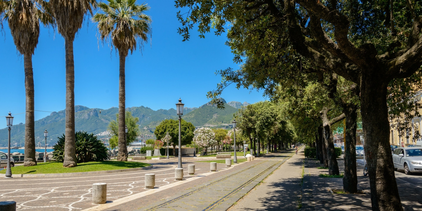 Salerno for family day with seafront promenade Lungomare Trieste with palm trees and walking path by the sea