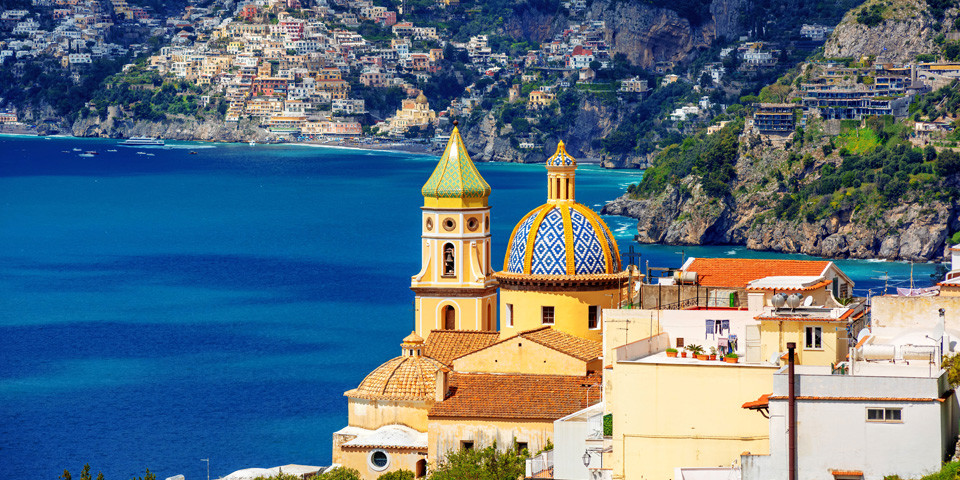 Panoramic view of the Church of San Gennaro in Praiano with its majolica dome and the coast beyond