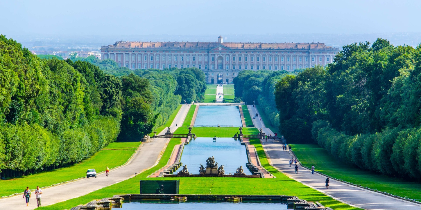 The royal gardens of the Palace of Caserta with fountains and the axial perspective towards the waterfall