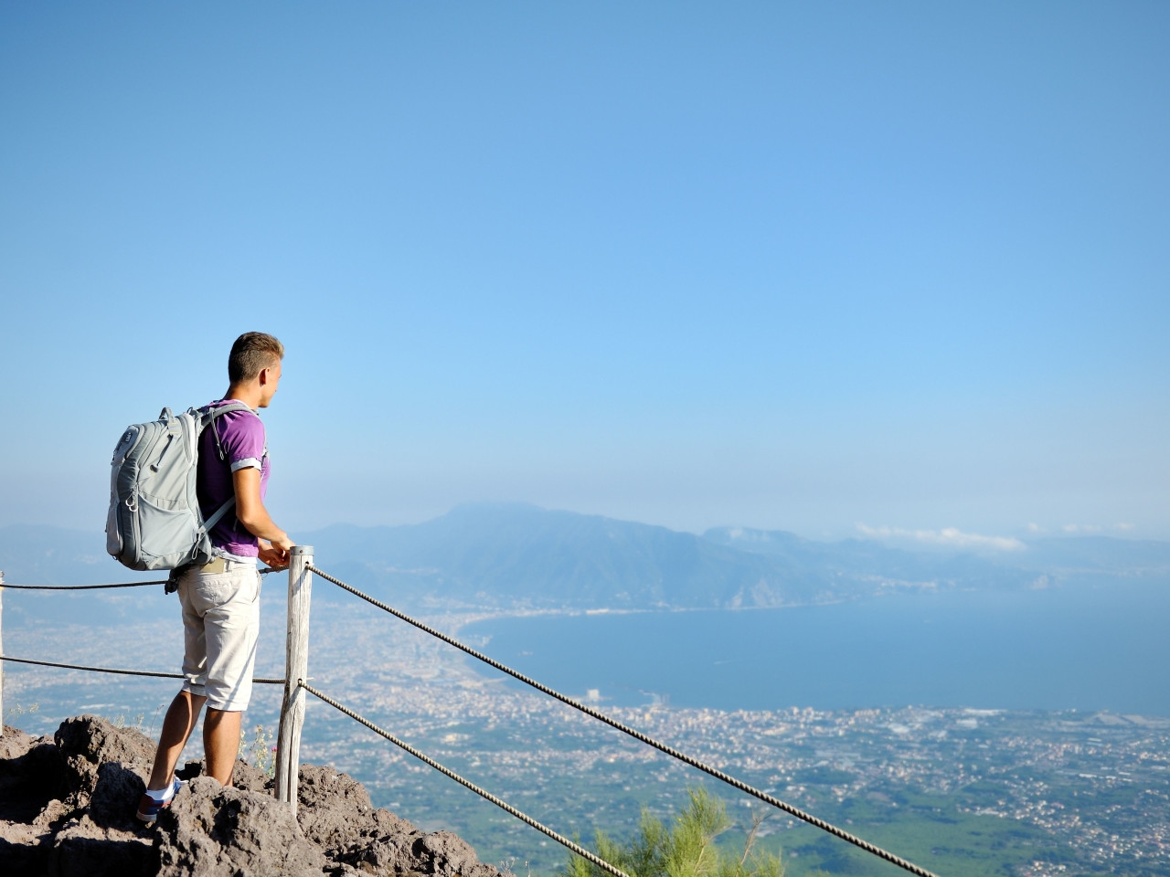 Hiker overlooking the Gulf of Naples with panoramic view
