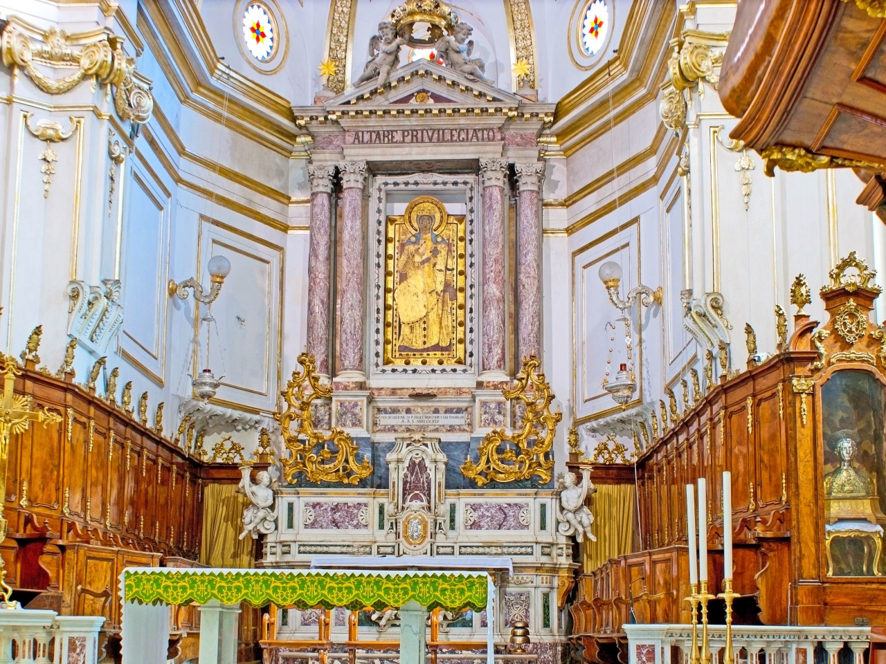 Decorated church interior in Positano with artistic details and baroque elements