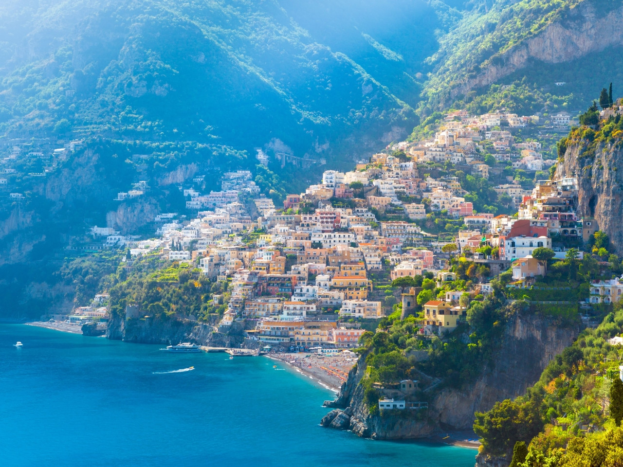 Panoramic view of Positano with beach, colorful houses and sea on the Amalfi Coast