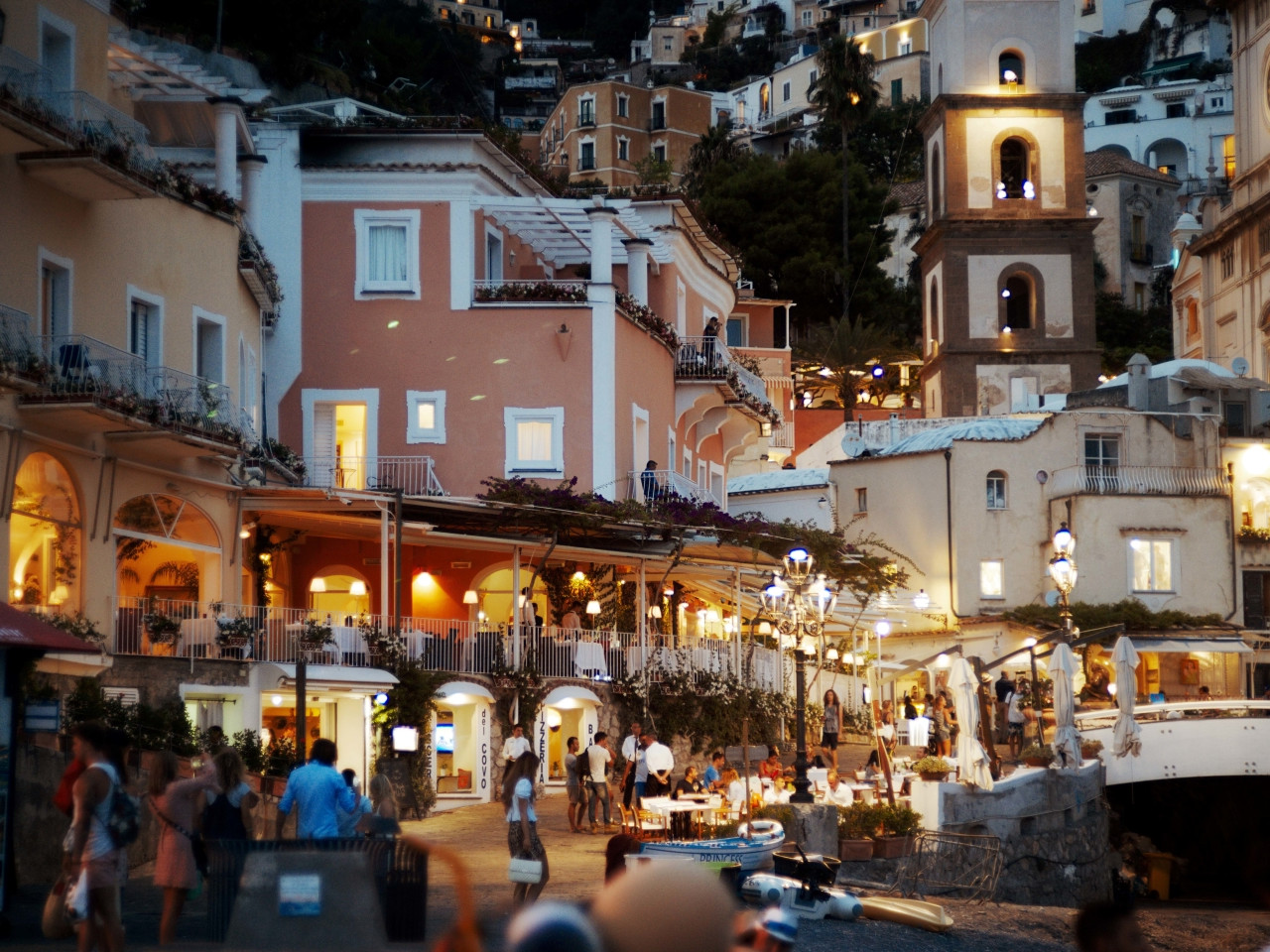 Romantic evening in Positano with lights, restaurants and seaside atmosphere