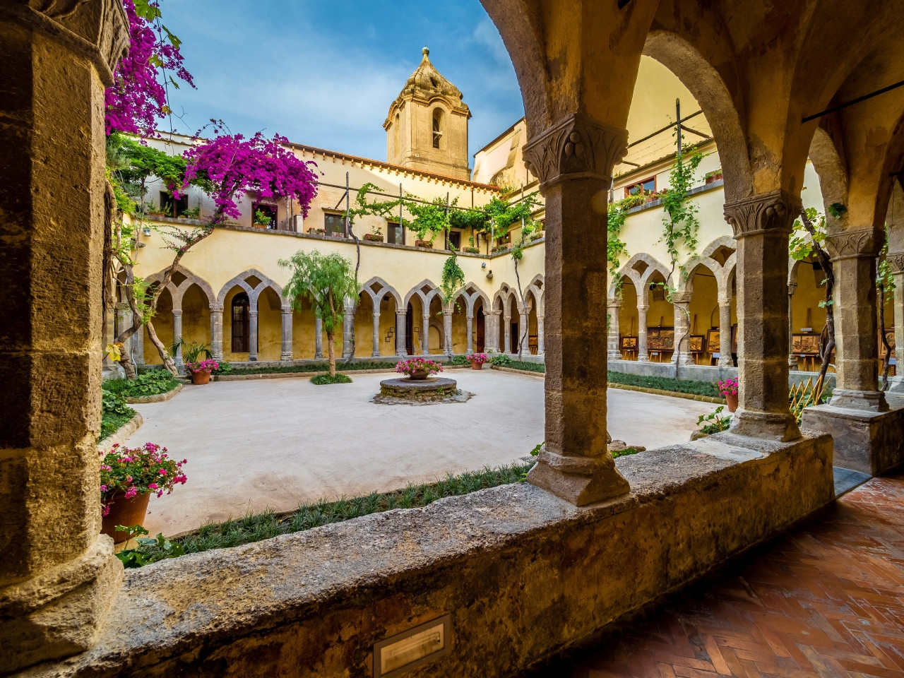 Cloister of San Francesco in Sorrento with arches, garden and historic architecture