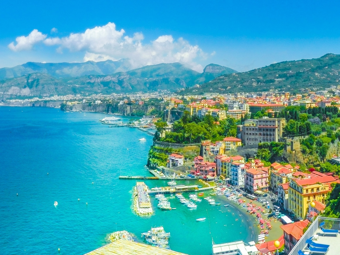 Panoramic view of Sorrento coastline with Marina Grande, colorful houses and Gulf of Naples