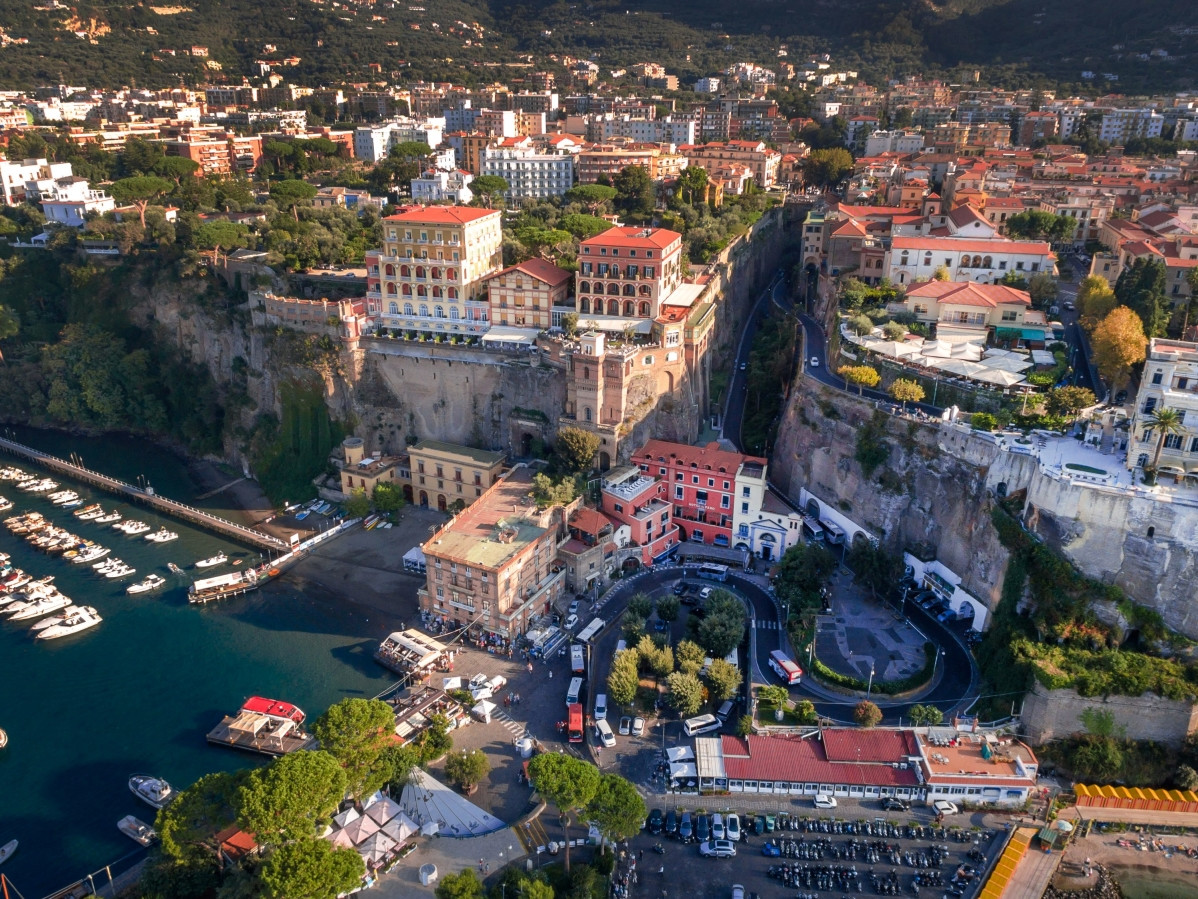 Aerial view of Marina Piccola in Sorrento with harbor, boats and cliffs