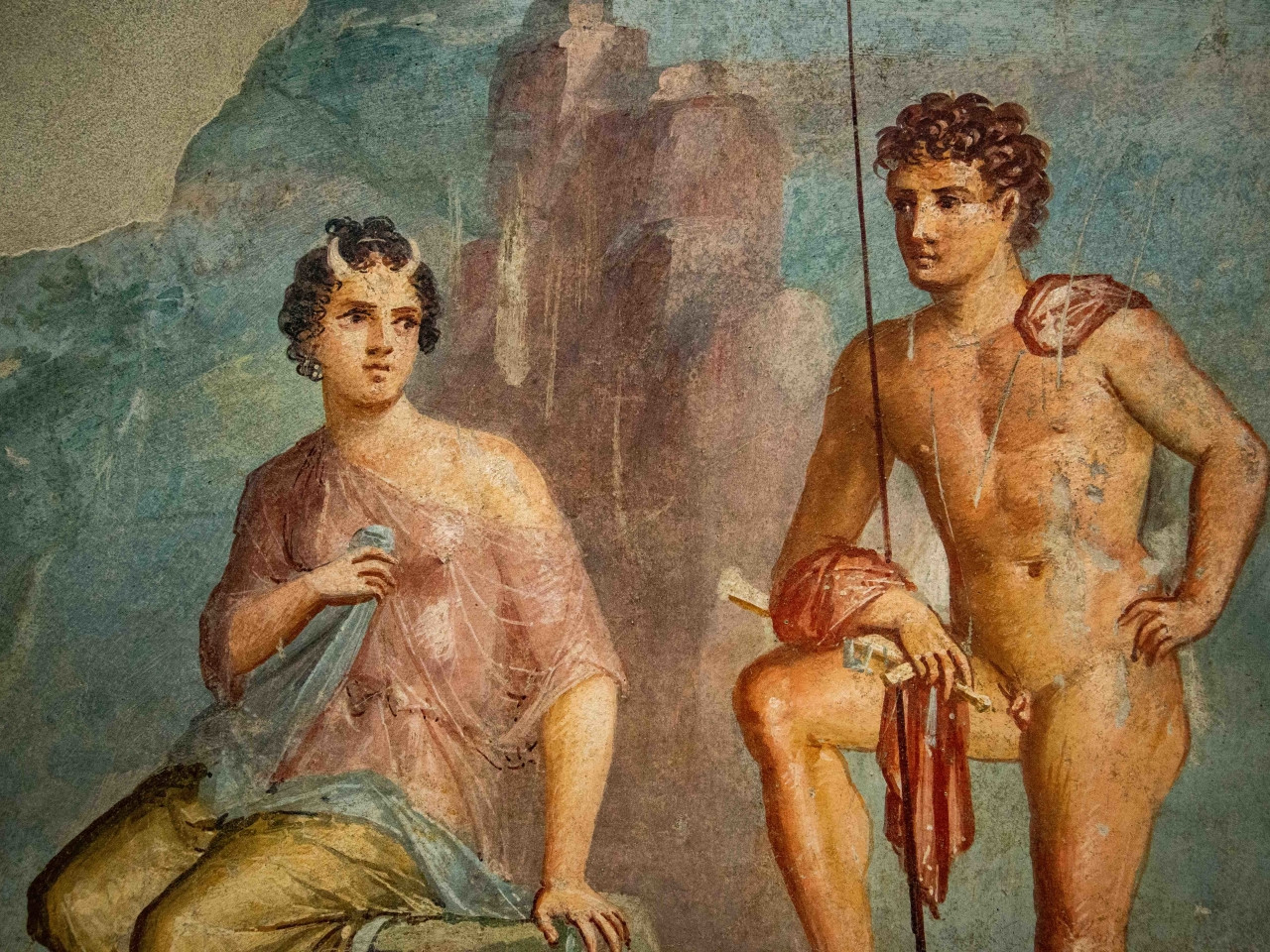Ancient Roman fresco from Pompeii depicting classical figures and decorative elements