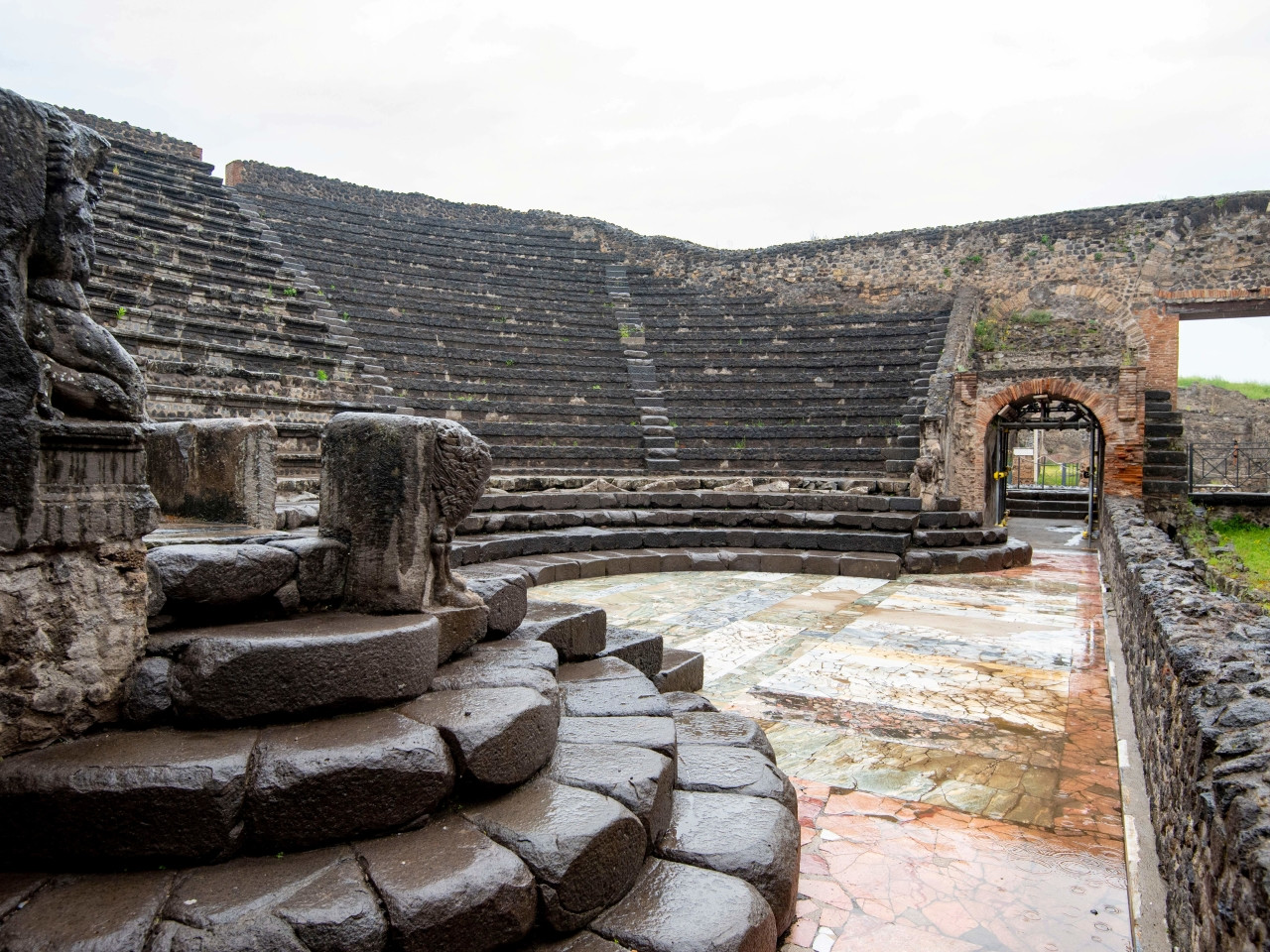 Ancient Roman theatre in Pompeii with stone seating and stage area