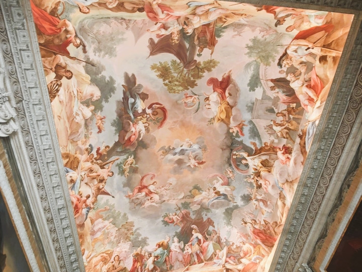 Baroque ceiling fresco in the Royal Palace of Caserta with painted figures