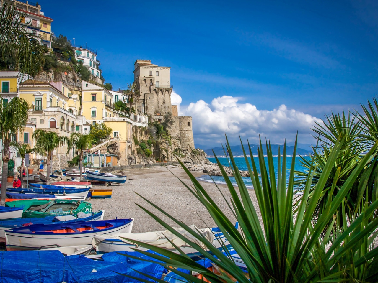 Cetara beach with the Viceregal Tower and fishing village on the Amalfi Coast