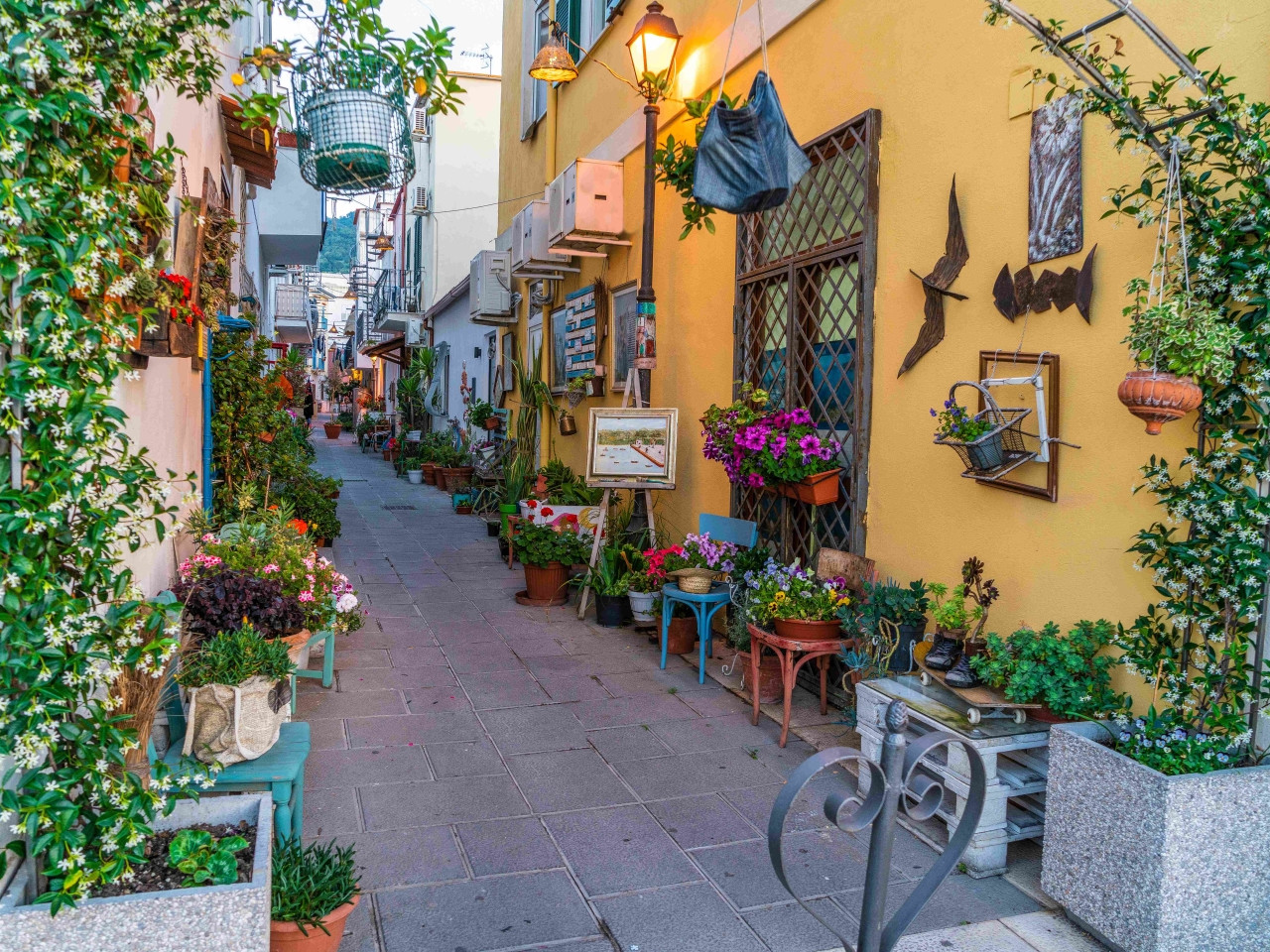 Flower-filled alley in a traditional village on Ischia Island