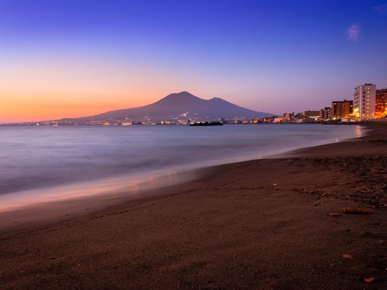 Sunset beach in Castellammare di Stabia with Mount Vesuvius in the background