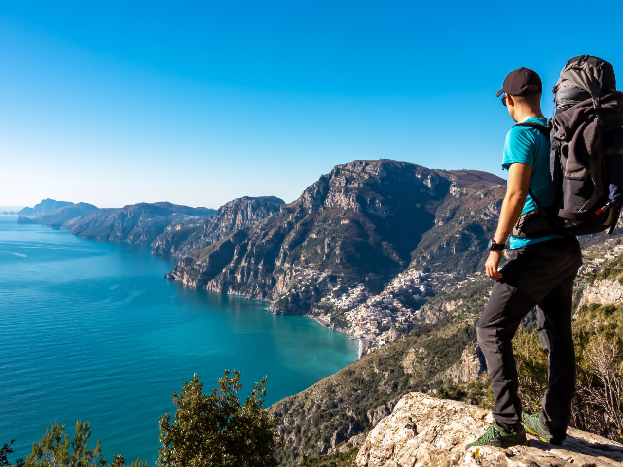 Hiker on the Path of the Gods above Praiano, with the Amalfi Coast below